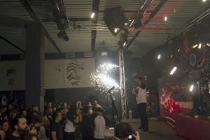 A member of the Romanian metal band 'Goodbye to Gravity' performs as firewoks erupt on the stage of a nightclub, before a fire broke out on Friday, in Bucharest